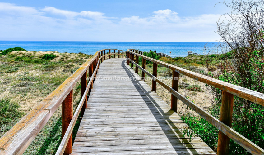 Which beaches are closest to your new home in the La Marina Urbanization?